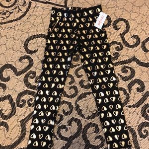 Black pants with gold hearts